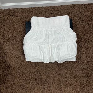 White flared skirt. Ruffled.
